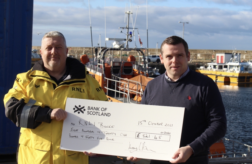 Douglas hands cheque to RNLI