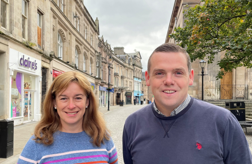 Douglas Ross and Kathleen Robertson stand on Elgin High Street