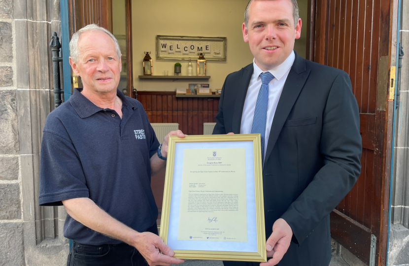 Douglas presents framed image of his Parliamentary motion to the Street Pastors