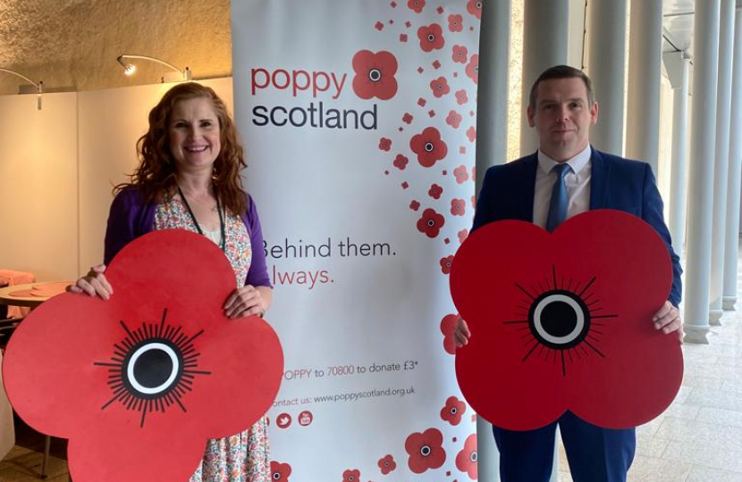 Douglas holds a large Poppy