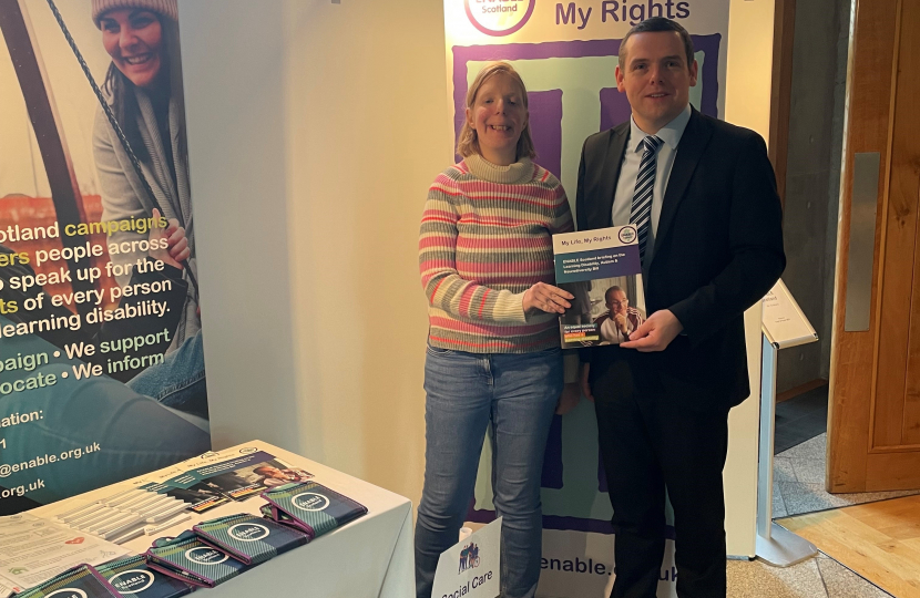 Douglas is pictured in the Scottish Parliament with Heather Gilchrist from ENABLE