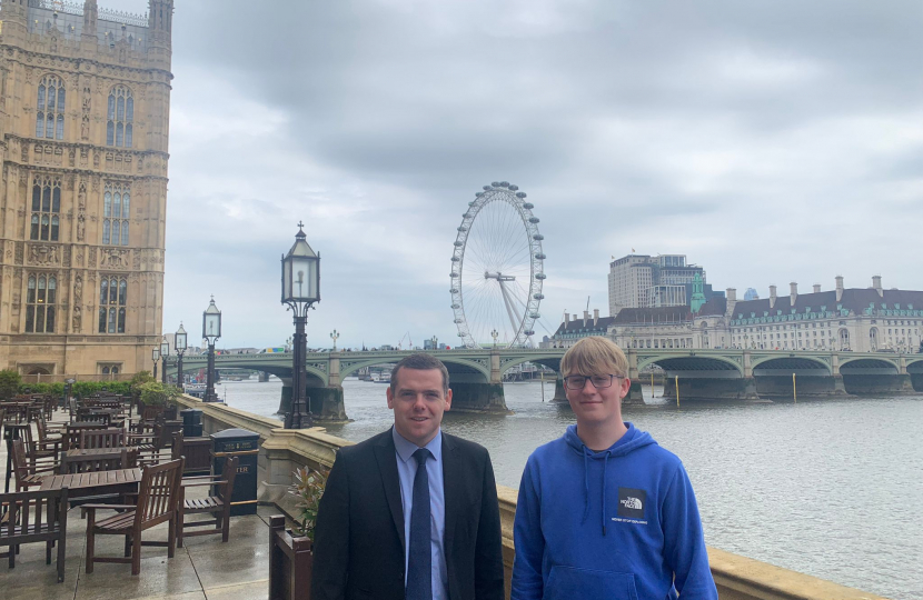 Douglas and Jack stand on the terrace of Westminster overlooking the London Eye