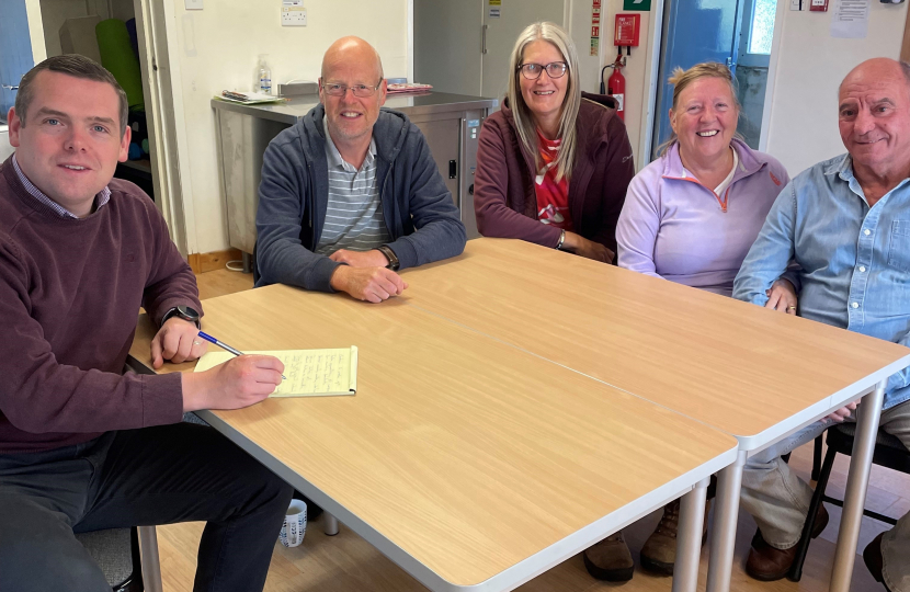 Douglas meeting local residents at his recent surgery in Roseisle Hall