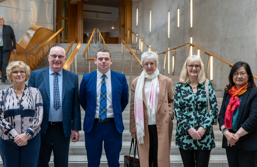 Douglas stands in Parliament with Save our Surgeries campaigners