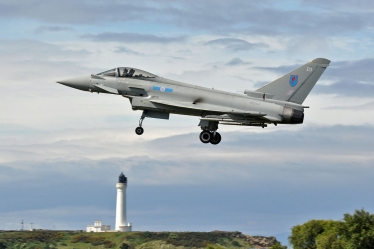 Typhoon flying over Lossiemouth lighthouse