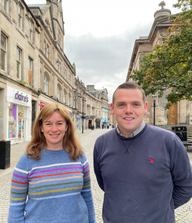 Douglas Ross and Kathleen Robertson stand on Elgin High Street