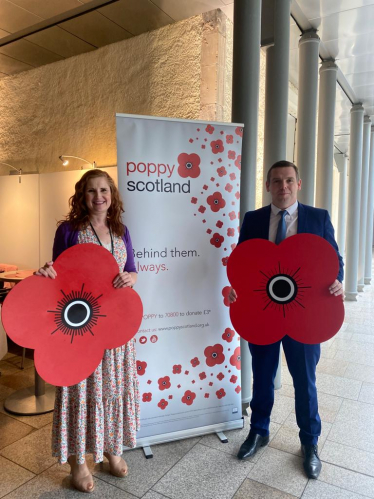 Douglas holds a large Poppy