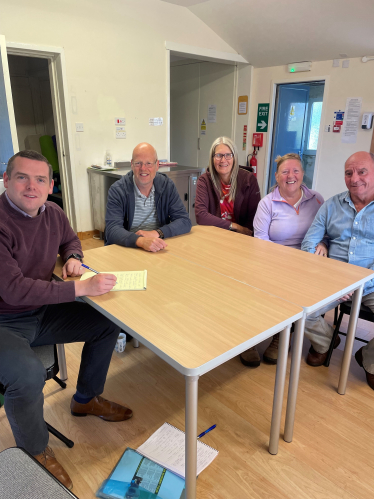 Douglas meeting local residents at his recent surgery in Roseisle Hall